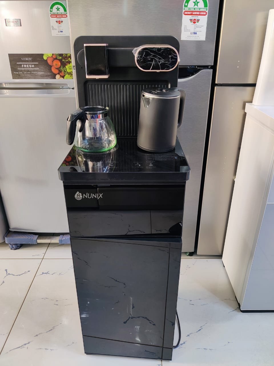 2026/06/1001561742.jpg Nunix A1C Bottom Load Hot And Cold Water Dispenser - Black and silver - Image 1